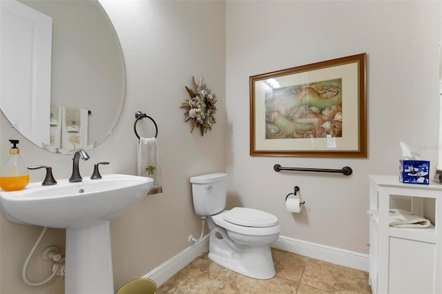 bathroom with sink, tile patterned floors, and toilet