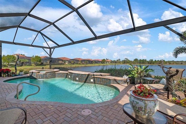 view of pool with an in ground hot tub, pool water feature, a water view, and glass enclosure