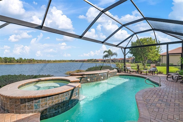 view of swimming pool featuring a patio, an in ground hot tub, pool water feature, glass enclosure, and a water view