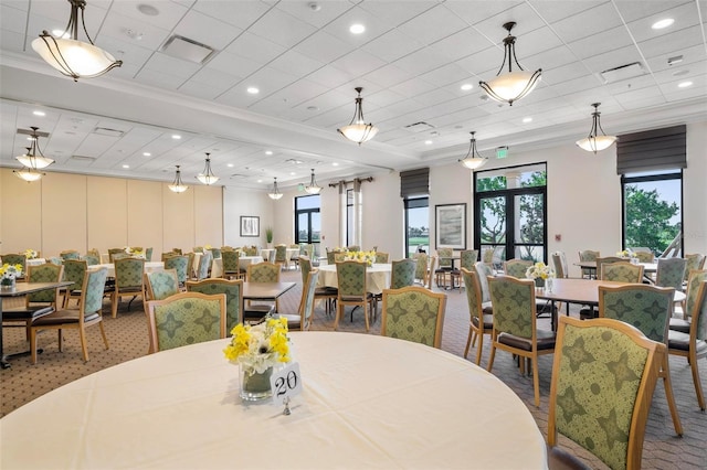 dining room with crown molding, carpet, and french doors