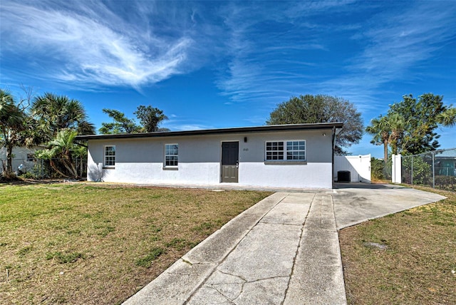 ranch-style house with a front lawn