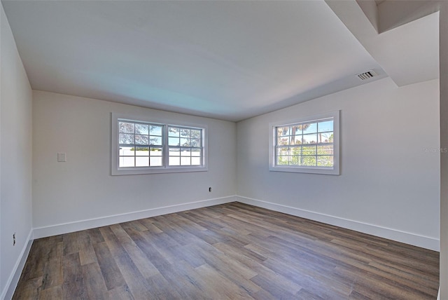 spare room with hardwood / wood-style floors