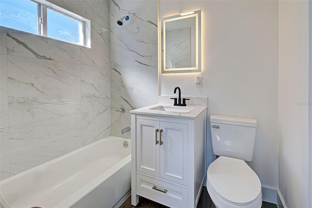 full bathroom with vanity, toilet, and tiled shower / bath