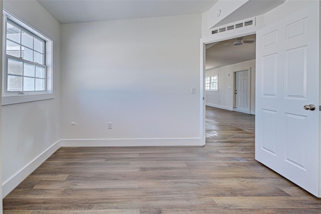 spare room featuring light hardwood / wood-style flooring