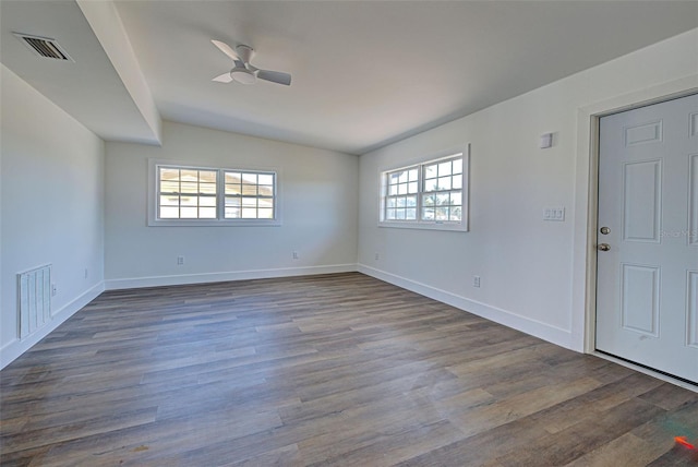 spare room featuring ceiling fan, lofted ceiling, and hardwood / wood-style floors