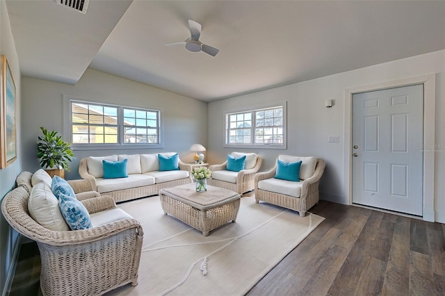 living room with ceiling fan, lofted ceiling, and dark hardwood / wood-style floors