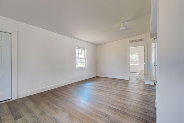 spare room with light hardwood / wood-style floors