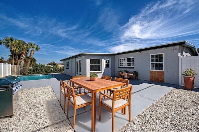 view of patio / terrace featuring a fenced in pool