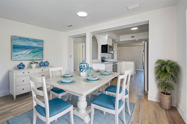 dining area featuring hardwood / wood-style floors