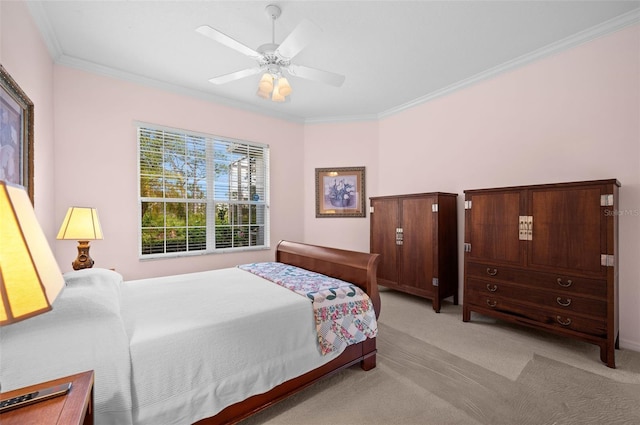 bedroom with crown molding, ceiling fan, and light colored carpet