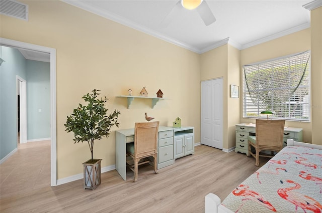 bedroom with crown molding, a closet, ceiling fan, and light wood-type flooring