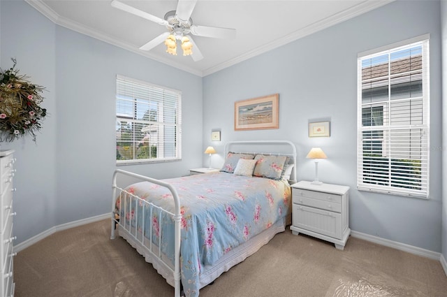 carpeted bedroom featuring crown molding and ceiling fan