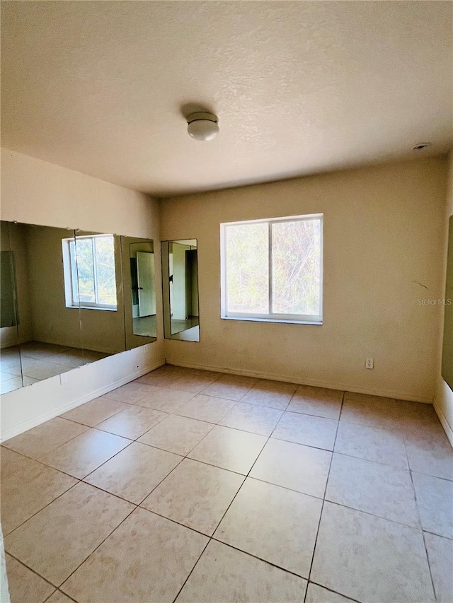 view of tiled spare room