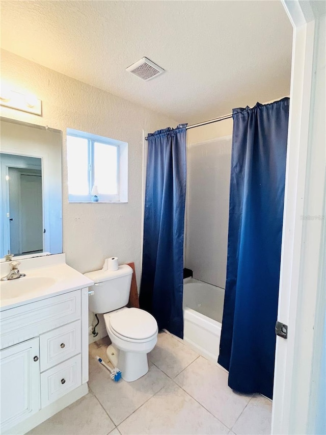 full bathroom featuring toilet, a textured ceiling, vanity, shower / bathtub combination with curtain, and tile patterned flooring