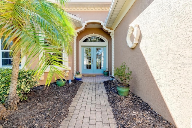 doorway to property with french doors and stucco siding