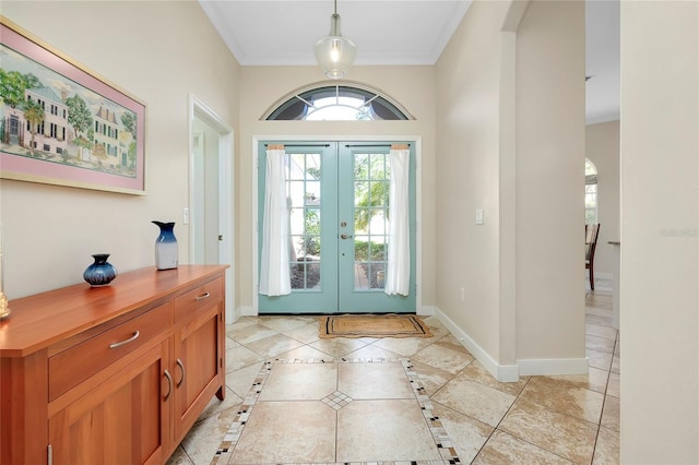 foyer entrance with french doors and baseboards