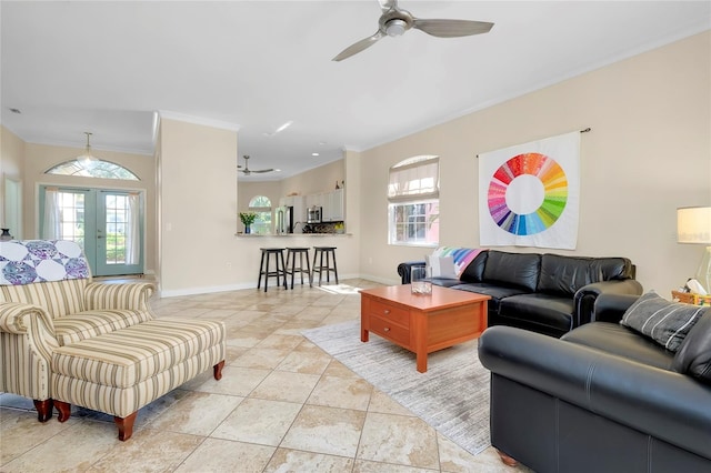 living area featuring french doors, crown molding, a ceiling fan, light tile patterned flooring, and baseboards