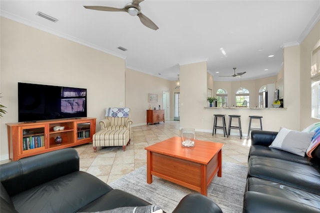 living room featuring a ceiling fan, visible vents, crown molding, and light tile patterned floors