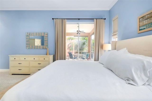 bedroom featuring light carpet and access to exterior