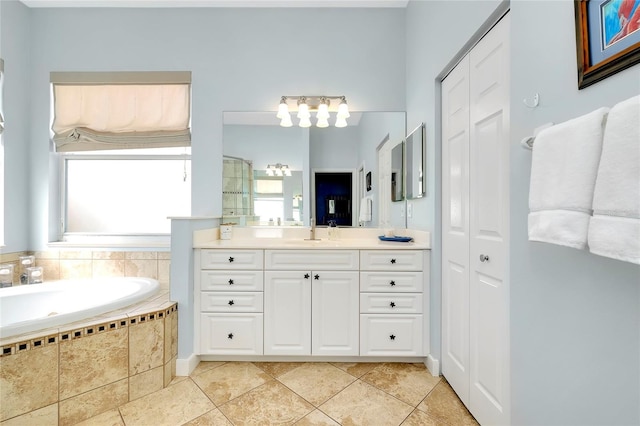 full bathroom with tile patterned flooring, a closet, and vanity