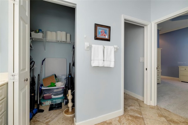 bathroom with tile patterned floors, vanity, and baseboards