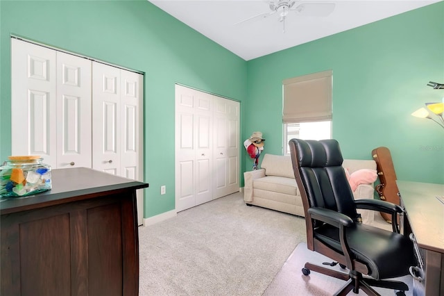 office with light carpet, baseboards, and a ceiling fan