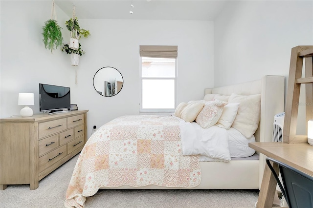 bedroom with light colored carpet