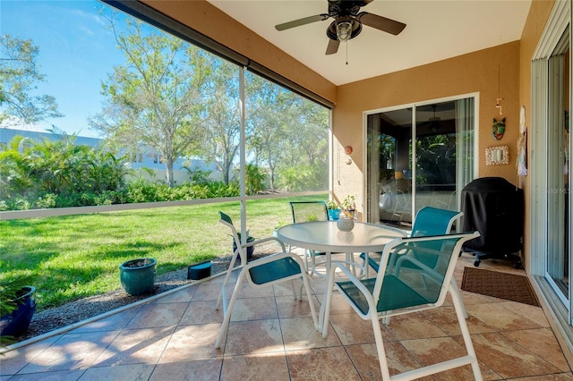 view of patio with outdoor dining space, a grill, and ceiling fan