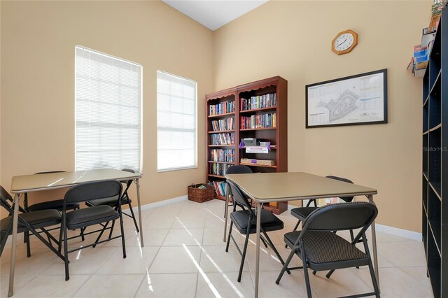 office featuring light tile patterned floors and baseboards