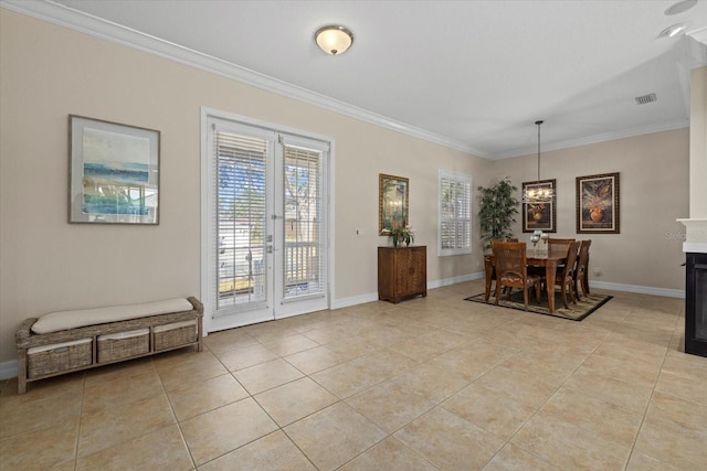 dining space with crown molding, french doors, and light tile patterned flooring