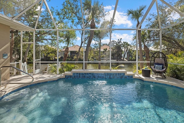 view of pool featuring a water view, pool water feature, and a lanai