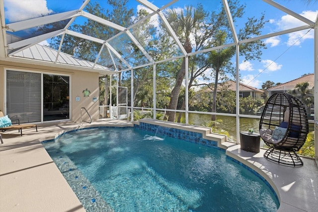 view of swimming pool featuring a patio, pool water feature, and glass enclosure