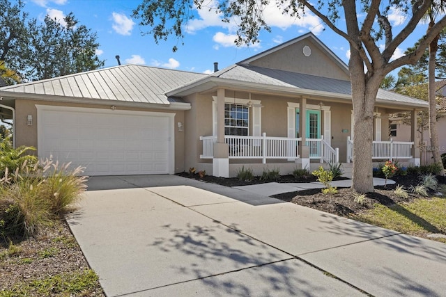 view of front of home with a garage and covered porch