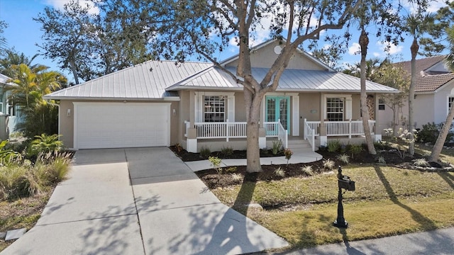 view of front of property featuring a garage and covered porch