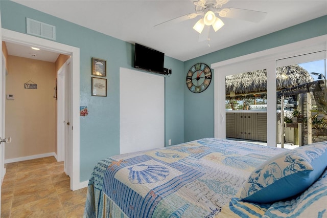 bedroom featuring baseboards, visible vents, and a ceiling fan