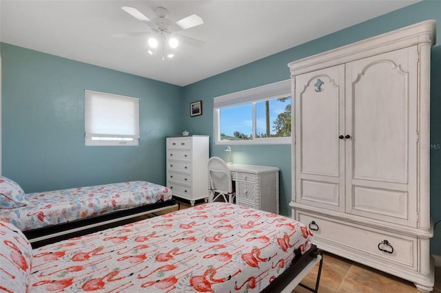 bedroom with ceiling fan and multiple windows