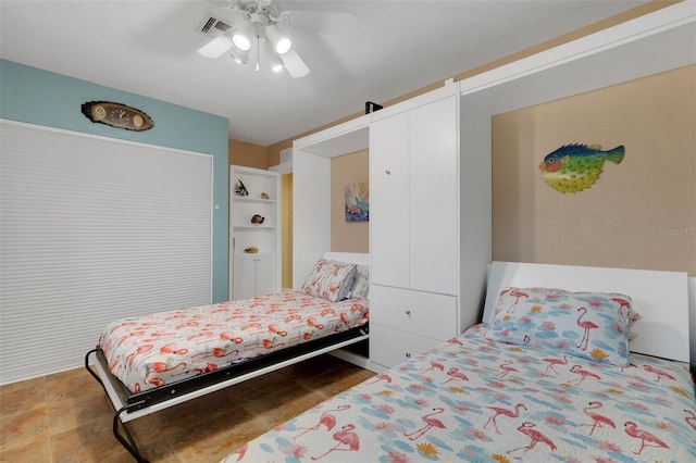 bedroom with ceiling fan and visible vents