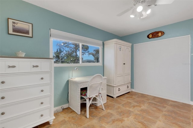 office with a ceiling fan and baseboards