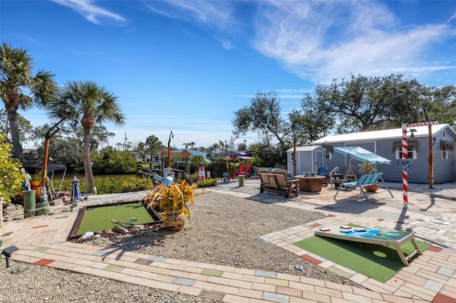 view of yard with a patio area and an outdoor fire pit