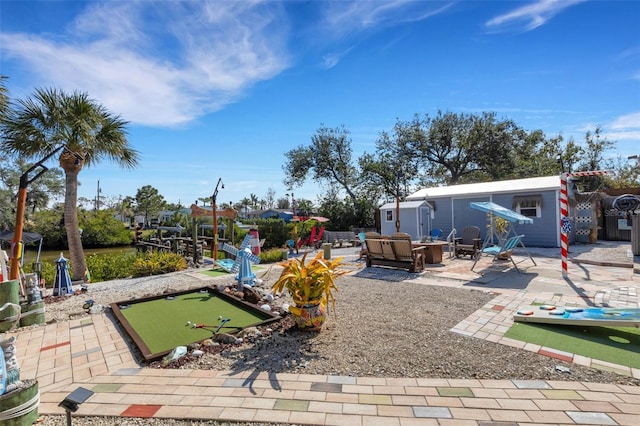 view of yard featuring a patio and an outdoor fire pit