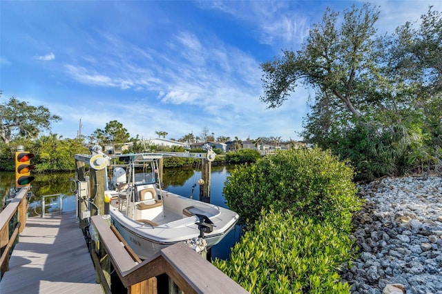 dock area featuring a water view and boat lift