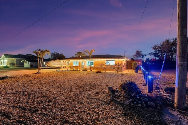 view of back of property at dusk