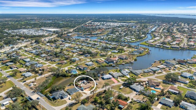 bird's eye view featuring a residential view and a water view