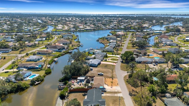 bird's eye view with a water view and a residential view