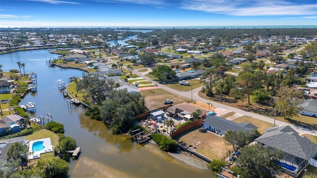 bird's eye view featuring a water view and a residential view