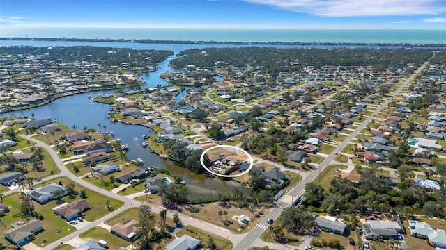 aerial view featuring a residential view and a water view