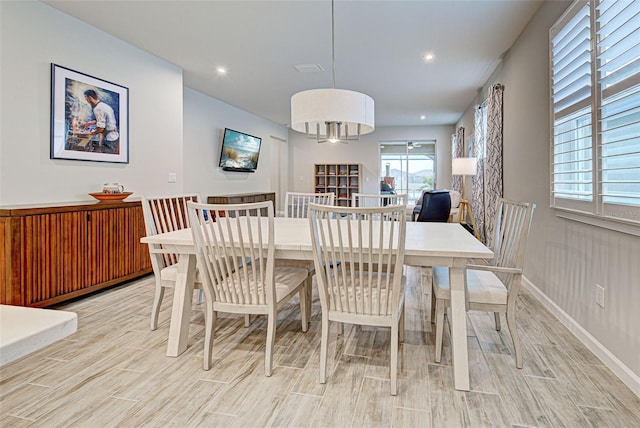 dining space featuring light hardwood / wood-style floors