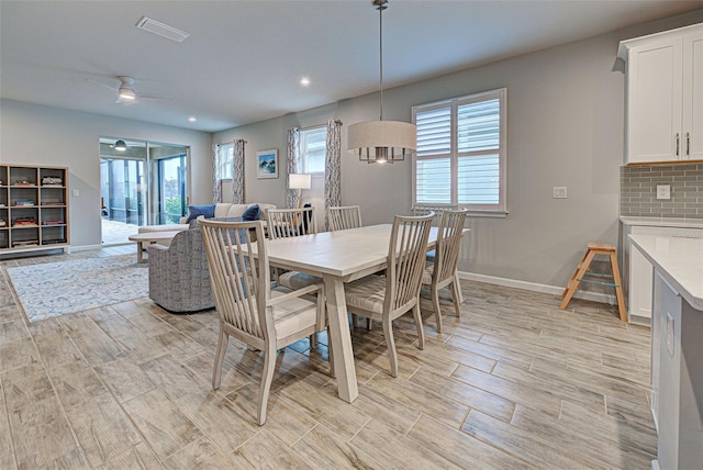 dining space featuring ceiling fan