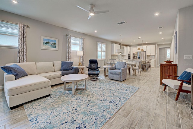 living room featuring ceiling fan