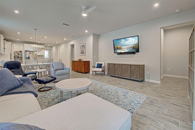 living room featuring ceiling fan